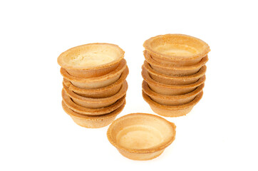 Empty sand tartlets isolated on white. Studio Photo