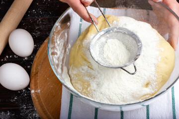 The process of making yeast dough. Sifting flour through a sieve. Cooking dough for baking bread.