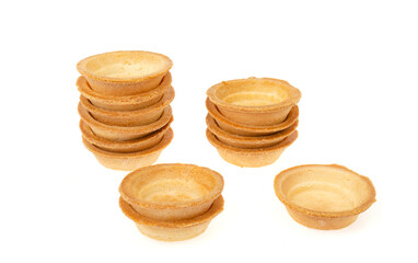 Empty sand tartlets isolated on white. Studio Photo
