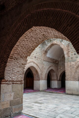 Fototapeta na wymiar Elazig, Turkey-September 18 2020: Arch-shaped door and the following arches in Great Mosque (Ulu Camii) in Harput Town