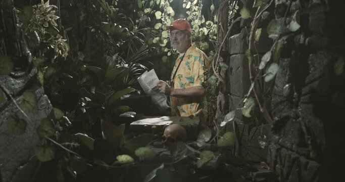 Scared tourist lost in the jungle with a map