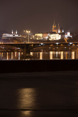 Fototapeta na wymiar .panoramic view of Prague Castle and St. Vitus Cathedral and the Vltava River and street lights on bridges at night in the center of Prague