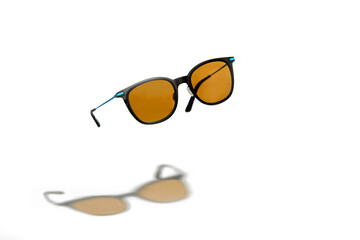 Conceptual elegant Sunglasses hovering isolated on white background. Sun glasses summer accessories...