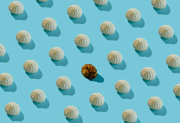 White seashells pattern on pastel pink background. Modern summer flat lay.