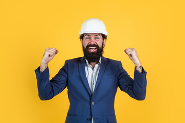 happy caucasian industrial manager at building construction site, engineering