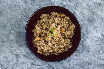 plant-based food, vegan buckwheat pasta with dairy-free creamy mushroom sauce and butter beans