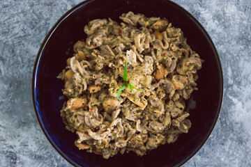 plant-based food, vegan buckwheat pasta with dairy-free creamy mushroom sauce and butter beans