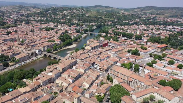 Aerial view of houses of Limoux old town and river Aude at sunny summer day, France