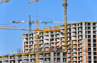 Crane and highrise construction site