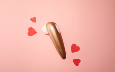 Woman vibrator flat lay banner. Valentines day. Sex toys wallpaper. Pink paper hearts 