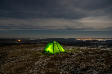 Fototapeta na wymiar Tent in winter on top of the mountain at night