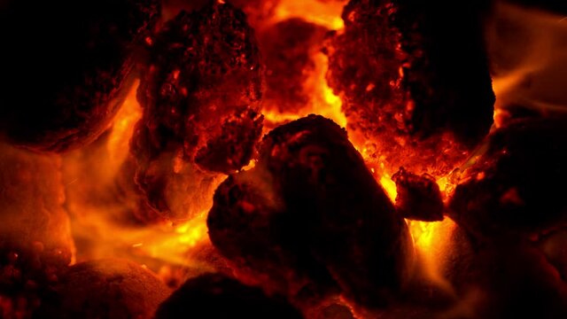 Super Slow Motion Shot of Glowing Coal and Fire Sparks at 1000fps.