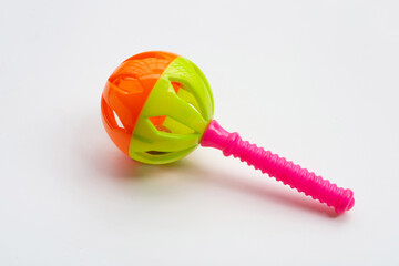 Colorful baby rattle on blue white