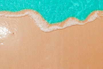 Soft Blue ocean wave on sandy beach. tropical white sand With the sea at the corner.