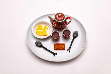 two cups of tea and cookies