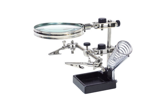Soldering stand with helping hands and manifying glass isolated on white background