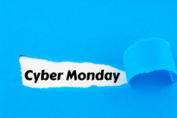 Cyber Monday - message appearing behind ripped blue paper. Best online shopping time. Day with biggest Sale. Mockup