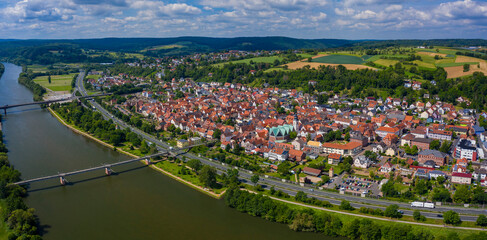 Aerial view of the city Obernburg in Germany on a cloudy day in spring.	