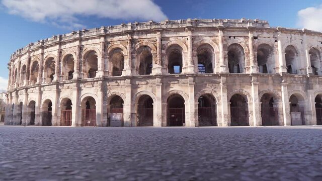 Roman arena in South of France, empty scenery of a tourist site in France during Covid-19 lockdown pandemic, on a sunny day