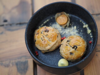 Thai traditional cookie in black bowl on wooden table