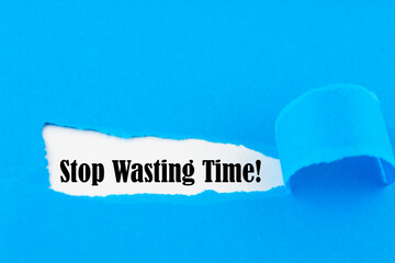 Stop Wasting Time text on paper. Word Stop Wasting Time on torn paper. Concept Image.