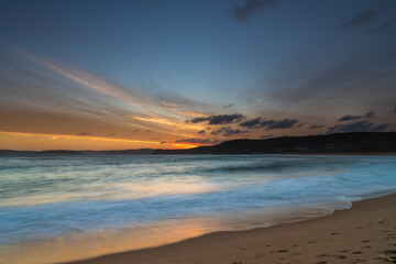 Fototapeta na wymiar Sunset and clouds at the seaside