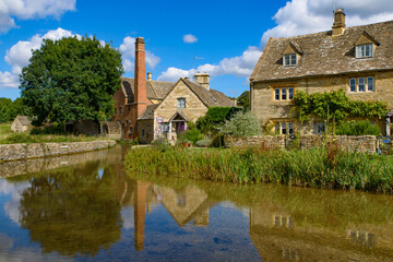 Fototapeta na wymiar Old water mill in Lower Slaughter, a village in Cotswolds area, England, UK