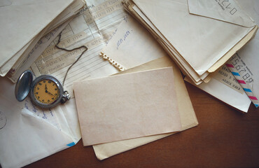 Vintage correspondence. Old letters and telegrams in Russian on a wooden table. Correspondence of...