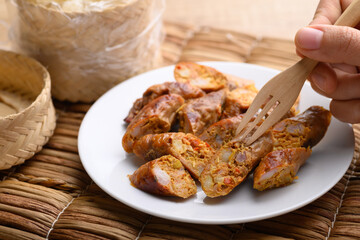 Northern Thai sausage (Sai Aua), Grilled intestine stuffed with minced pork, spices and herbs, popular food in Chiangmai, Thailand