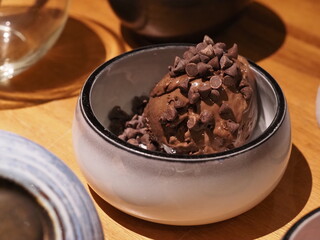 Dark chocolate ice cream in bowl