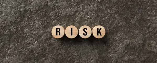 Fototapeta premium message RISK on wet lava stone background