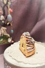 Traditional cupcake Easter cake kraffin craffin with raisins on dark purple background. homemade cake Cruffin with dried fruits. Easter decoration table. easter desert celebration. Layers of the cake
