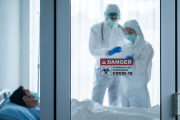Group of doctor checking disease of male patient who infected COVID-19