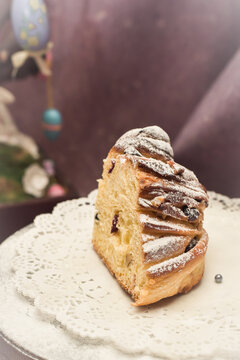 Traditional cupcake Easter cake kraffin craffin with raisins on dark purple background. homemade cake Cruffin with dried fruits. Easter decoration table. easter desert celebration. Layers of the cake