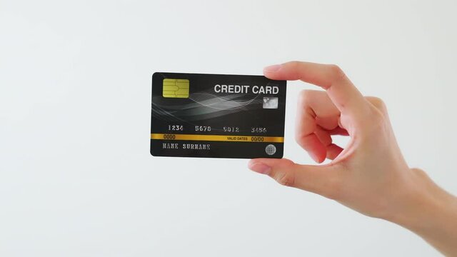 Hand holding mockup credit cards and showing on the white background.