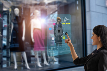 smart retail, shopping online technology concept, woman try to use smart display with virtual or...