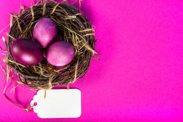 Colorful background with Easter eggs on pink background. Happy Easter concept. Can be used as poster, background, holiday card. Flat lay, top view, copy space. Studio Photo