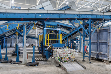 Household waste sorting and recycling plant. Press for pressing plastic bottles
