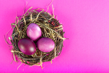 Colorful background with Easter eggs on pink background. Happy Easter concept. Can be used as poster, background, holiday card. Flat lay, top view, copy space. Studio Photo