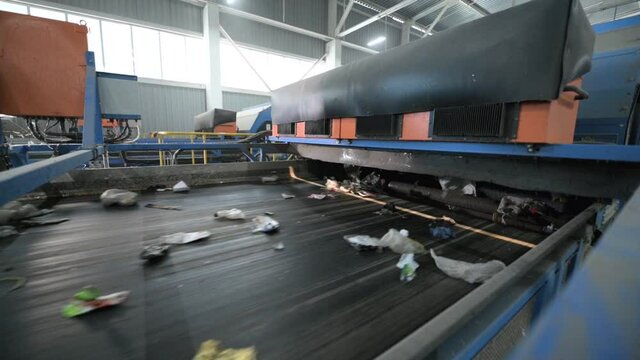 Automatic opto-pneumatic garbage sorting machine.