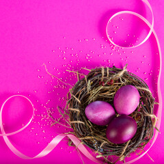 Colorful background with Easter eggs on pink background. Happy Easter concept. Can be used as poster, background, holiday card. Flat lay, top view, copy space. Studio Photo