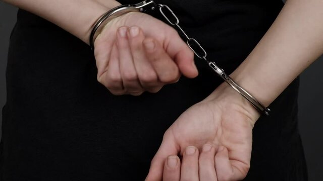 girl trying to get out of handcuffs