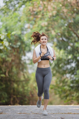 asian woman in sportswear running exercise for health success on countryside. health care concept.