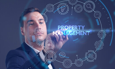 Business, Technology, Internet and network concept. Young businessman working on a virtual screen of the future and sees the inscription: Property management