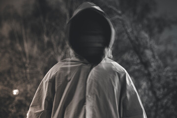 Fototapeta na wymiar Blurred man on exposure in the street. Ghost silhouette