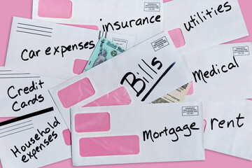 United States stimulus check partially buried under multiple bills and envelopes with pink background and copy space