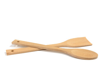 Cooking wooden spoon and spatula on white insulated background.Selective focus.