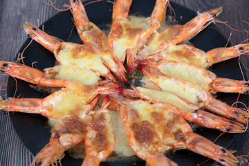 A plate of prawns baked with cheese