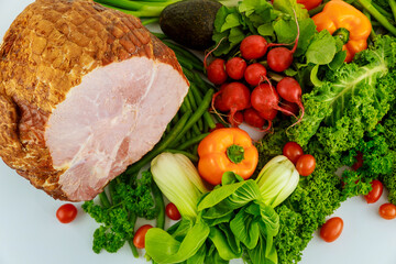 Hickory smoked whole ham with fresh vegetables.