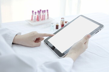 Doctor hands use a tablet, hospital lab, on the work table,Working doctor,white office of the hospital, healthcare concept